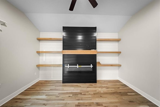 detailed view of ceiling fan, wood finished floors, and baseboards