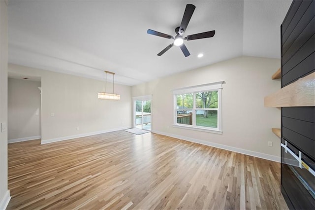 unfurnished living room featuring light wood finished floors, a ceiling fan, baseboards, and recessed lighting