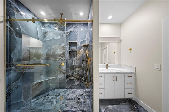 bathroom with marble finish flooring, vanity, a marble finish shower, baseboards, and ceiling fan