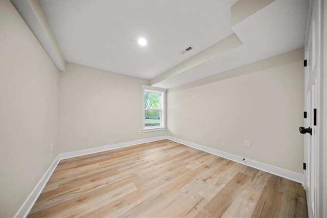unfurnished room with baseboards, light wood-style floors, and recessed lighting