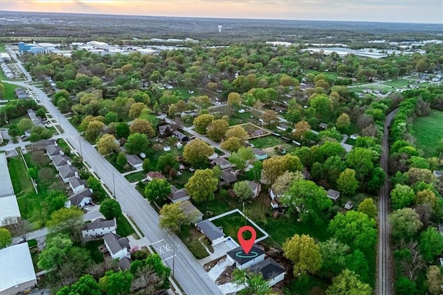 view of property location featuring a tree filled landscape