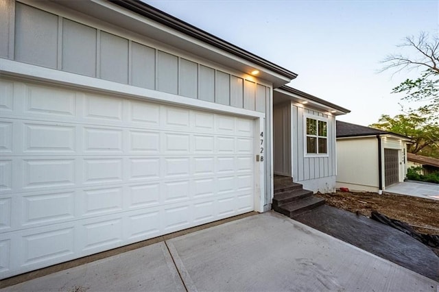view of front facade featuring concrete driveway and board and batten siding