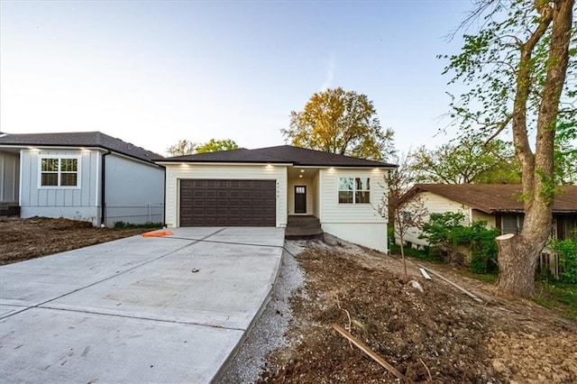 view of front of house featuring driveway, a garage, and board and batten siding