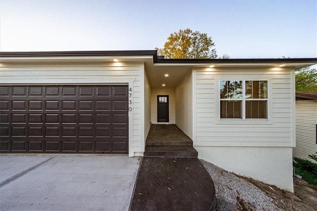 view of front of home with driveway and an attached garage