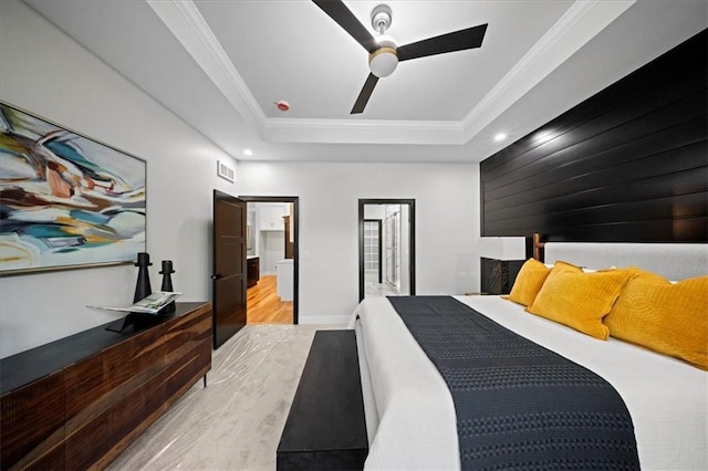 bedroom featuring a tray ceiling, wood finished floors, recessed lighting, ornamental molding, and ceiling fan