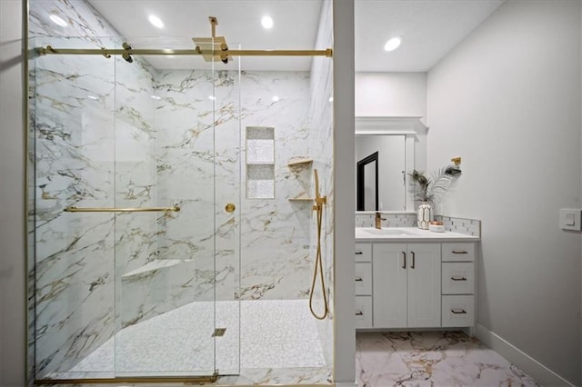 full bath featuring marble finish floors, a marble finish shower, vanity, recessed lighting, and baseboards