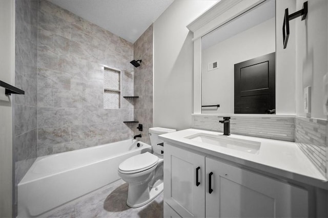 bathroom with toilet, washtub / shower combination, vanity, and tasteful backsplash