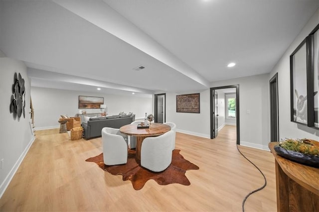 dining room featuring light wood-style flooring, baseboards, and recessed lighting
