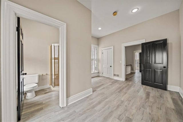 interior space with recessed lighting, baseboards, light wood-type flooring, and visible vents