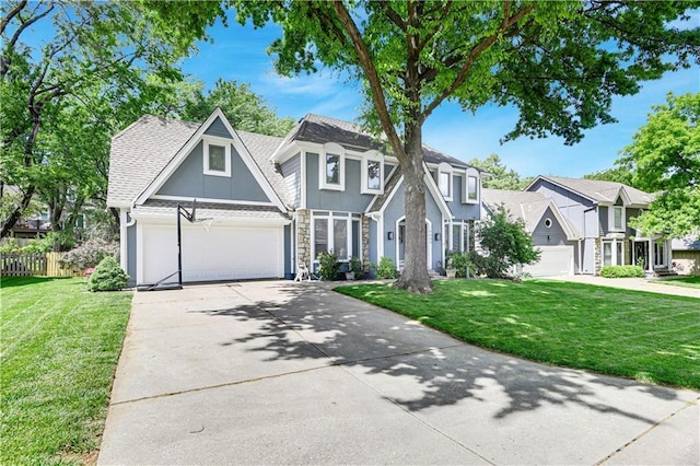 6600 W 125th Ter, Overland Park, KS 66209 - view of front facade featuring concrete driveway, stucco siding, stone siding, and a shingled roof