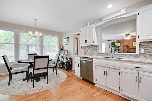 6600 W 125th Ter, Overland Park, KS 66209 - kitchen featuring stainless steel dishwasher, plenty of natural light, a sink, a chandelier, and recessed lighting