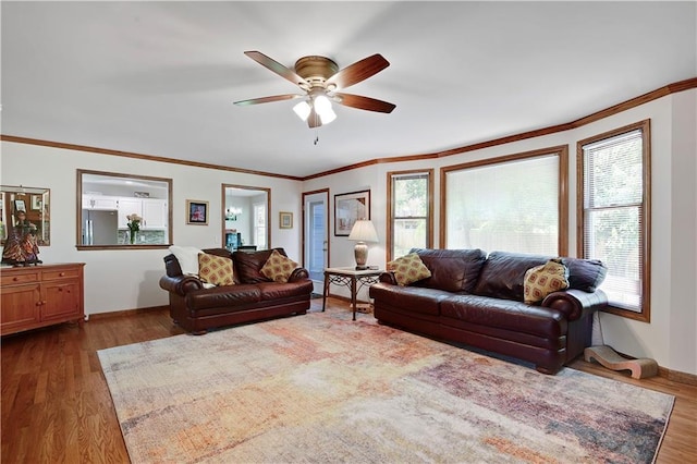 6600 W 125th Ter, Overland Park, KS 66209 - living room with a ceiling fan, wood finished floors, ornamental molding, and baseboards