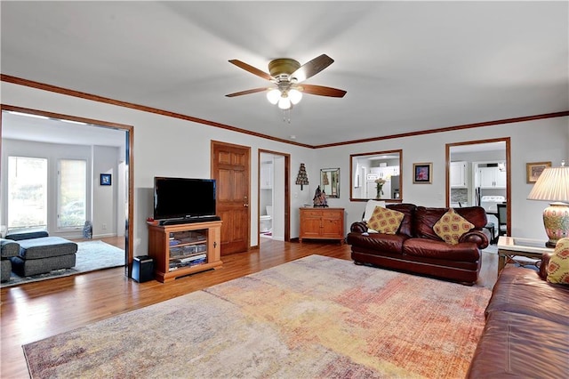 6600 W 125th Ter, Overland Park, KS 66209 - living area featuring a ceiling fan, wood finished floors, baseboards, and crown molding