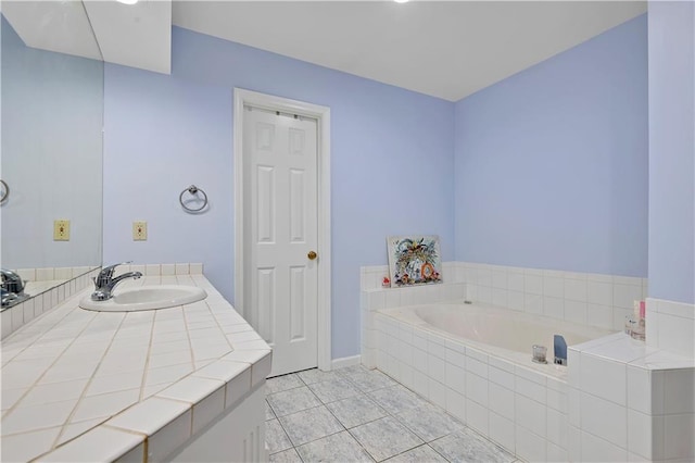 6600 W 125th Ter, Overland Park, KS 66209 - bathroom featuring a garden tub, tile patterned floors, vanity, and baseboards