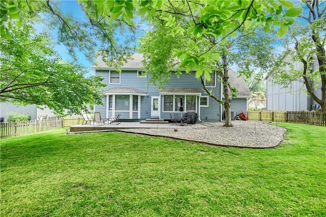 6600 W 125th Ter, Overland Park, KS 66209 - back of property with a patio area and roof with shingles