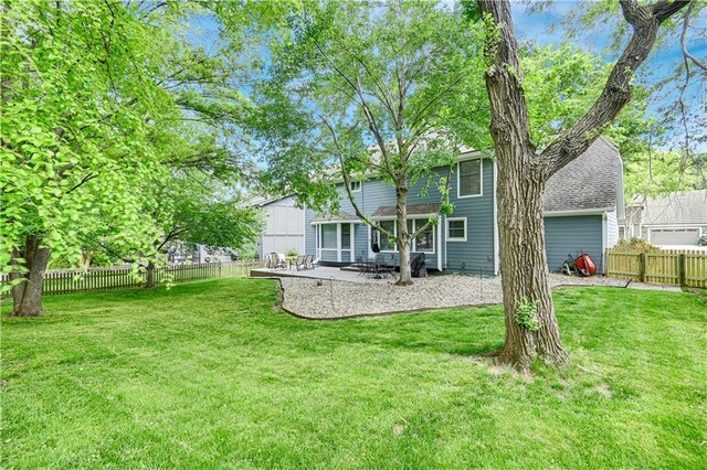 6600 W 125th Ter, Overland Park, KS 66209 - rear view of house featuring a patio