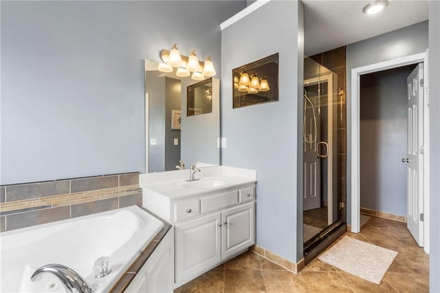 bathroom featuring vanity, tile patterned floors, a tub with jets, and a shower stall