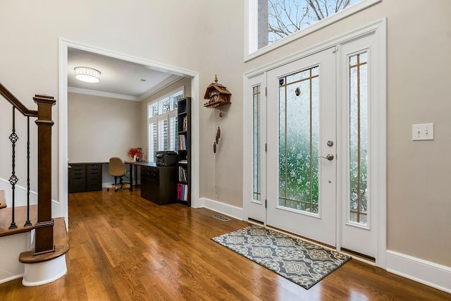 10863 S Cedar Niles Cir, Olathe, KS 66061 - entryway featuring crown molding, stairway, wood finished floors, and baseboards