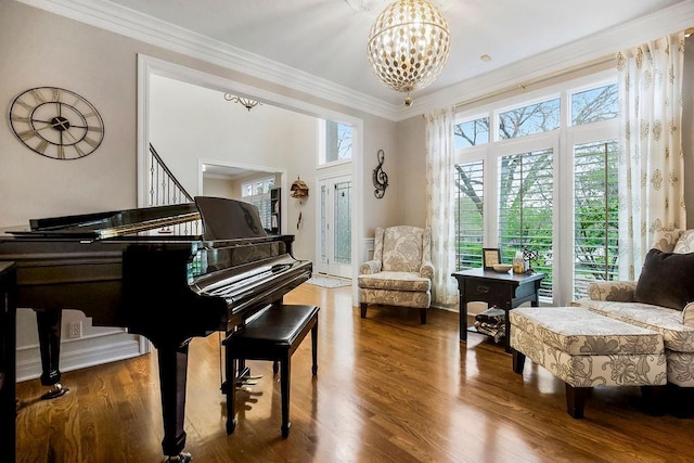 10863 S Cedar Niles Cir, Olathe, KS 66061 - living area with wood finished floors, ornamental molding, and a chandelier