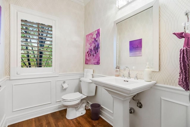 10863 S Cedar Niles Cir, Olathe, KS 66061 - half bath featuring wallpapered walls, wood finished floors, toilet, a wainscoted wall, and a decorative wall