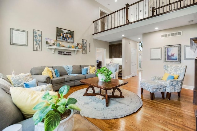 10863 S Cedar Niles Cir, Olathe, KS 66061 - living area featuring a high ceiling, light wood finished floors, baseboards, and recessed lighting