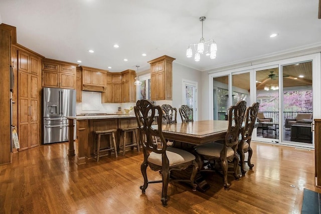 10863 S Cedar Niles Cir, Olathe, KS 66061 - dining space featuring ornamental molding, dark wood finished floors, a chandelier, and recessed lighting