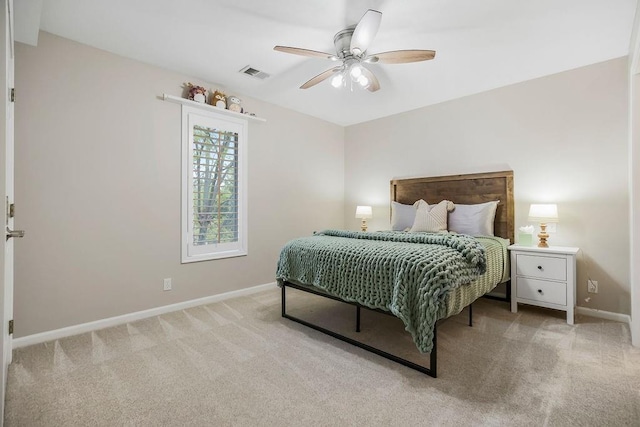10863 S Cedar Niles Cir, Olathe, KS 66061 - bedroom with light carpet, baseboards, and ceiling fan
