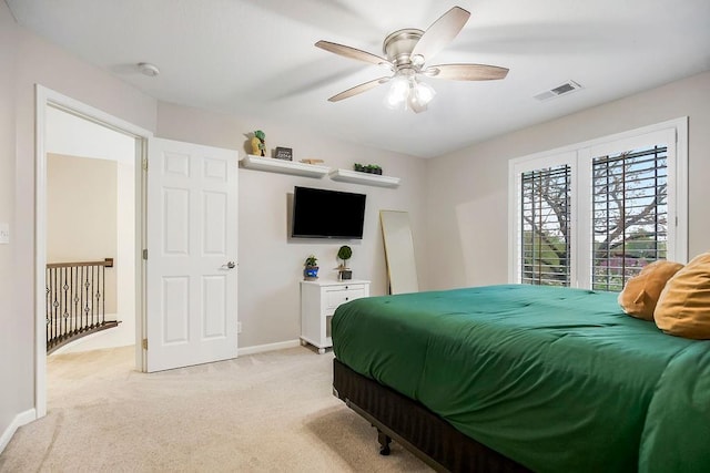 10863 S Cedar Niles Cir, Olathe, KS 66061 - bedroom with light colored carpet, baseboards, and a ceiling fan