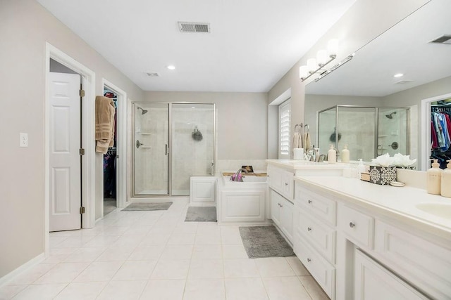 10863 S Cedar Niles Cir, Olathe, KS 66061 - full bath featuring a shower stall, a walk in closet, a bath, tile patterned floors, and recessed lighting