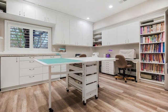 10863 S Cedar Niles Cir, Olathe, KS 66061 - office area with light wood-type flooring, built in desk, and recessed lighting