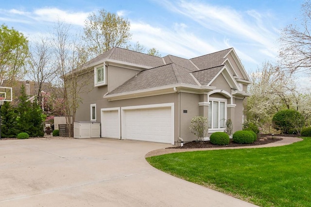 10863 S Cedar Niles Cir, Olathe, KS 66061 - view of side of property featuring stucco siding, driveway, a garage, a lawn, and roof with shingles