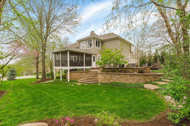10863 S Cedar Niles Cir, Olathe, KS 66061 - rear view of house featuring a sunroom, stucco siding, a yard, stairway, and a chimney