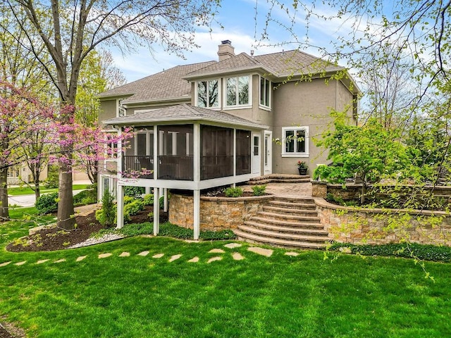 10863 S Cedar Niles Cir, Olathe, KS 66061 - rear view of property with a sunroom, a shingled roof, stucco siding, a yard, and stairway