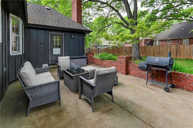 1400 SW 8th Ter, Lees Summit, MO 64081 - view of patio with a fenced backyard, area for grilling, and an outdoor living space with a fire pit