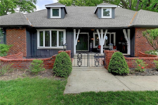 1400 SW 8th Ter, Lees Summit, MO 64081 - view of front of property with covered porch, a shingled roof, and brick siding