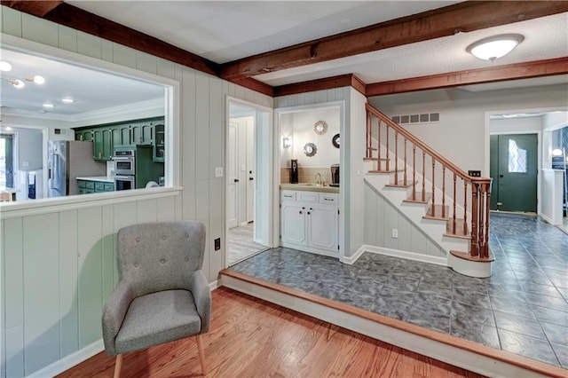 1400 SW 8th Ter, Lees Summit, MO 64081 - living area featuring stairs, beam ceiling, baseboards, and crown molding