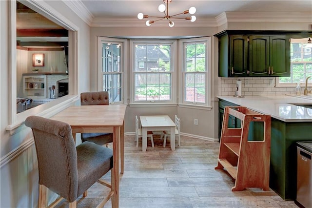 1400 SW 8th Ter, Lees Summit, MO 64081 - dining space with a chandelier, healthy amount of natural light, light wood finished floors, and ornamental molding
