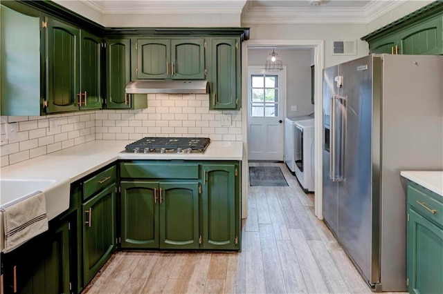 1400 SW 8th Ter, Lees Summit, MO 64081 - kitchen featuring green cabinets, stainless steel appliances, under cabinet range hood, and crown molding