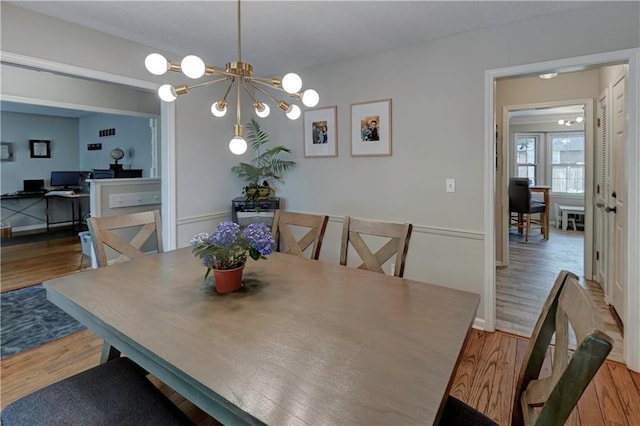 1400 SW 8th Ter, Lees Summit, MO 64081 - dining space with wood finished floors and a chandelier