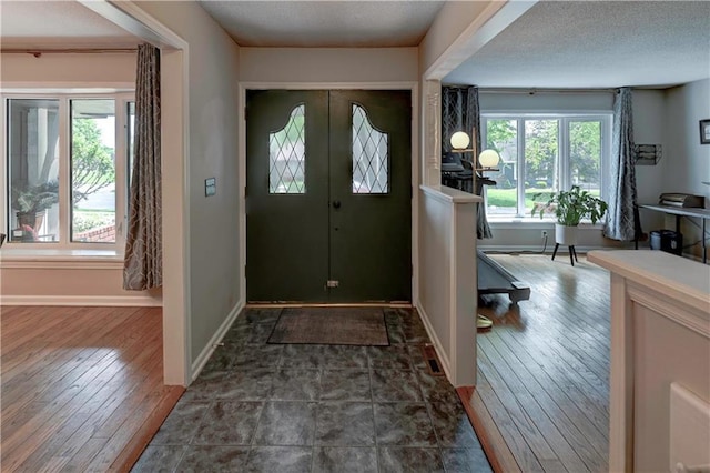 1400 SW 8th Ter, Lees Summit, MO 64081 - foyer entrance featuring hardwood / wood-style flooring, baseboards, and a textured ceiling
