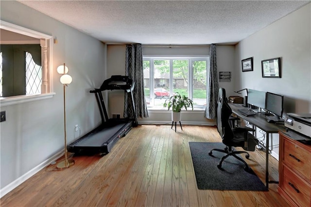 1400 SW 8th Ter, Lees Summit, MO 64081 - office area with a textured ceiling, wood-type flooring, and baseboards
