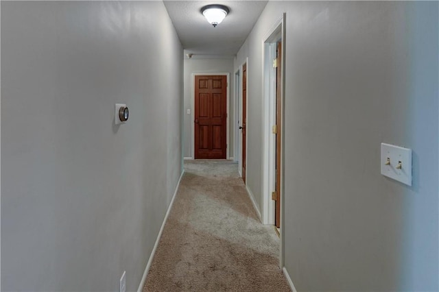 1400 SW 8th Ter, Lees Summit, MO 64081 - hallway featuring light carpet and baseboards
