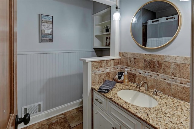 1400 SW 8th Ter, Lees Summit, MO 64081 - bathroom with wainscoting, vanity, and baseboards