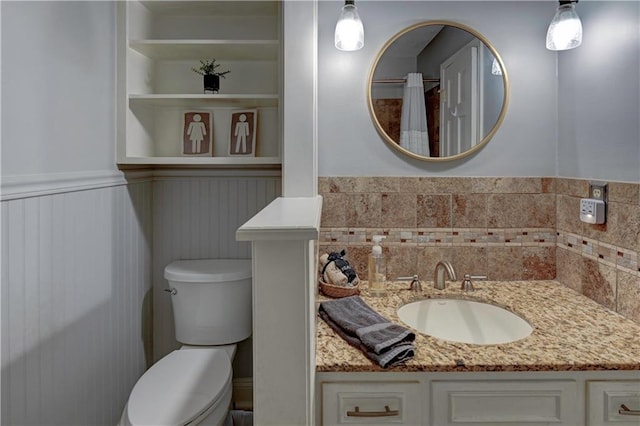 1400 SW 8th Ter, Lees Summit, MO 64081 - bathroom with toilet, a wainscoted wall, and vanity