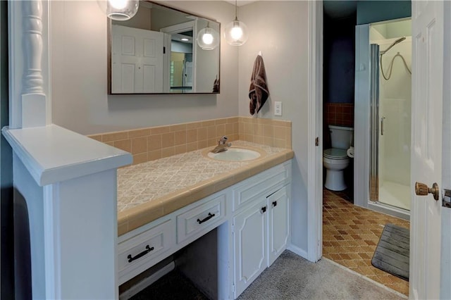 1400 SW 8th Ter, Lees Summit, MO 64081 - bathroom featuring a stall shower, vanity, toilet, and decorative backsplash