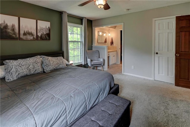 1400 SW 8th Ter, Lees Summit, MO 64081 - carpeted bedroom featuring ensuite bath, a ceiling fan, and baseboards