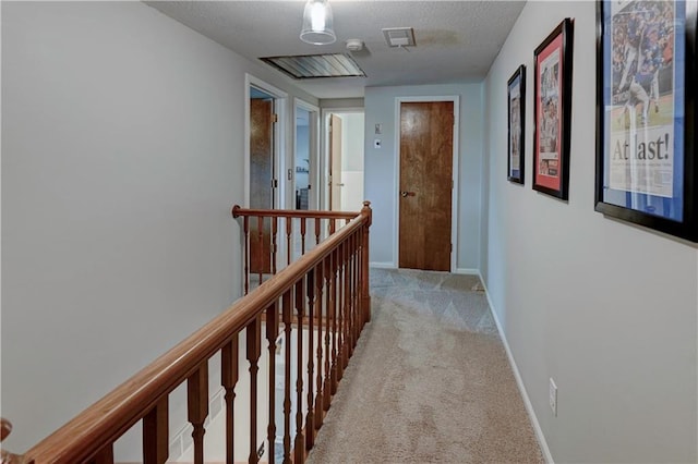 1400 SW 8th Ter, Lees Summit, MO 64081 - hallway featuring an upstairs landing, light carpet, baseboards, and a textured ceiling