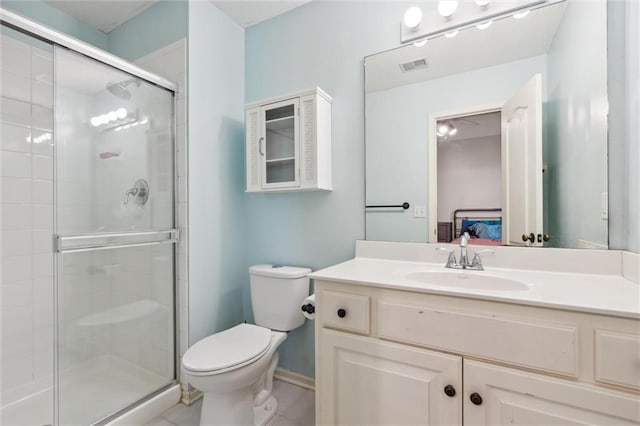 bathroom featuring visible vents, tile patterned flooring, vanity, toilet, and a shower stall