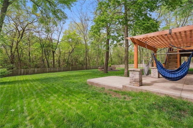 view of yard with a patio, a fenced backyard, and a pergola