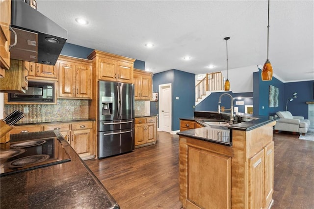 kitchen with exhaust hood, dark wood finished floors, a sink, and black appliances